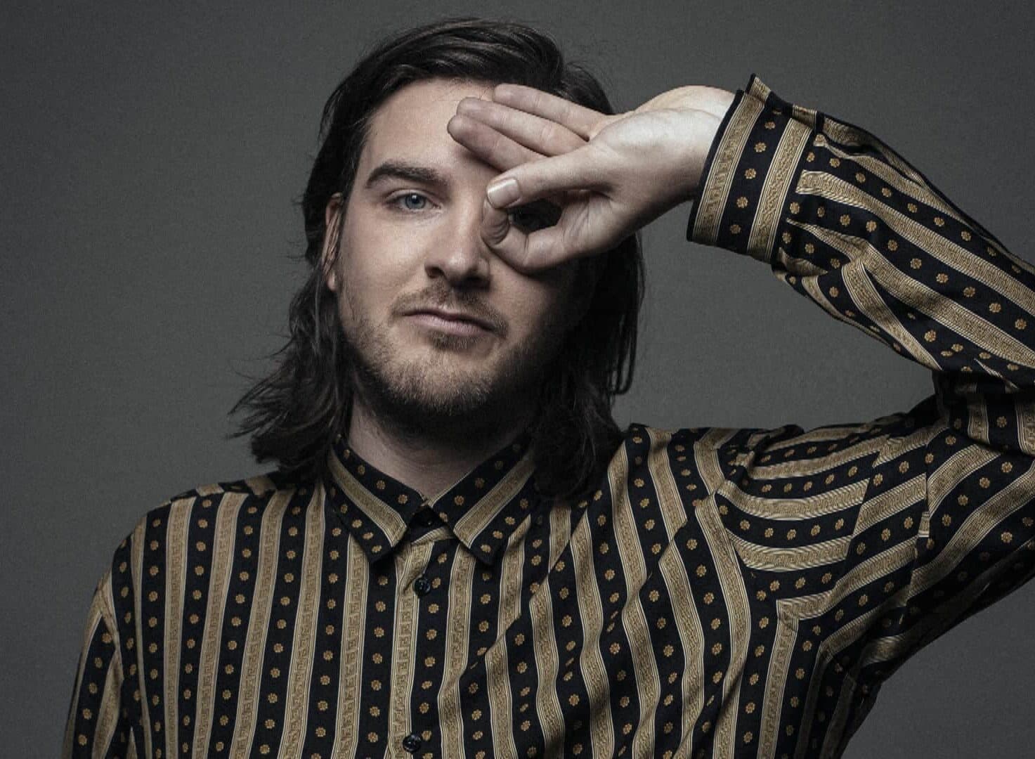 Reinier Zonneveld wearing a black and gold patterned shirt